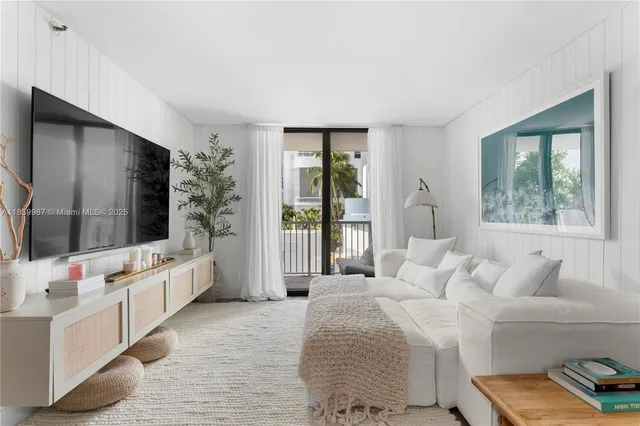 a spacious bedroom with a large bed and a flat screen tv