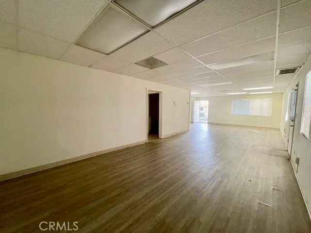 a view of a room with wooden floor
