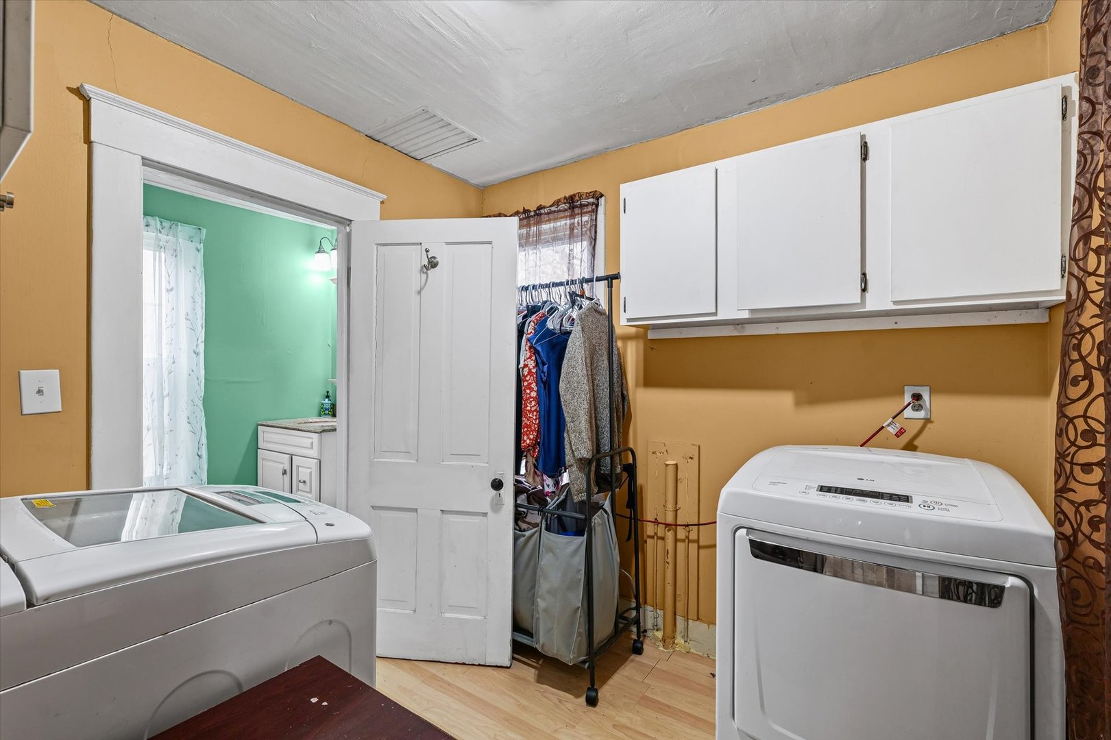 2210 Fogel Road Mahomet, IL 61853 - Photo 17 of 33 a bathroom with a sink and a washing machine