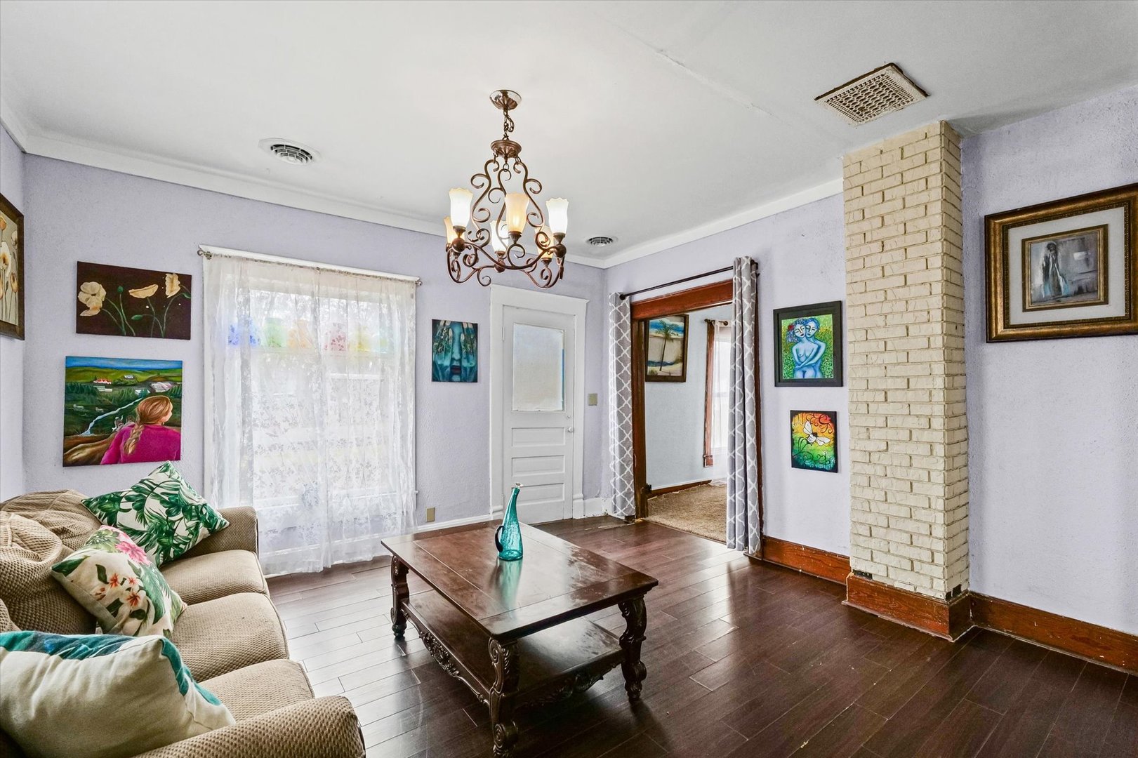 2210 Fogel Road Mahomet, IL 61853 - Photo 5 of 33 a living room with furniture and a chandelier