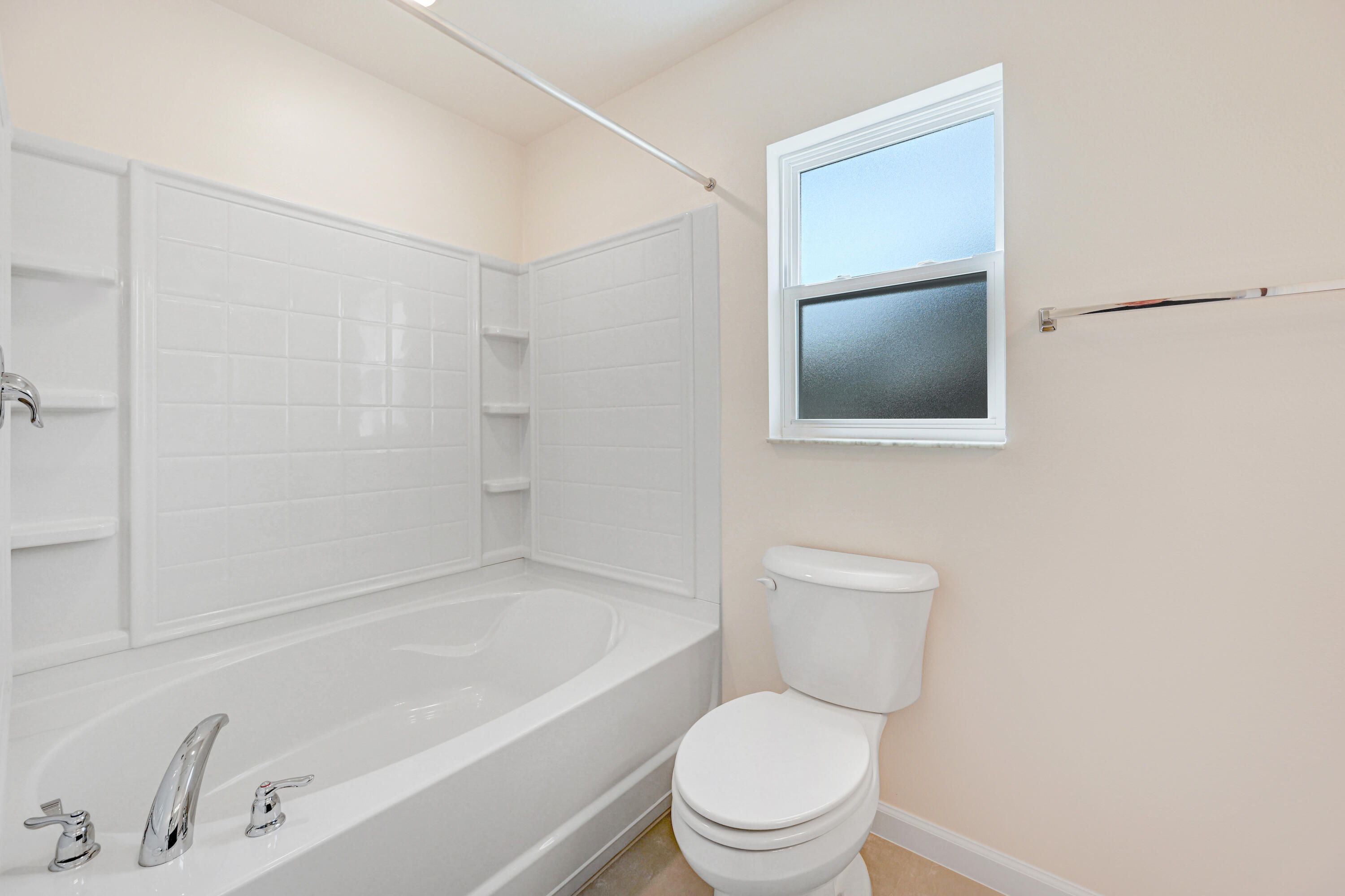 239 Trilby Road Southwest Palm Bay, FL 32908 - Photo 26 of 38 a bathroom with a toilet and a bathtub