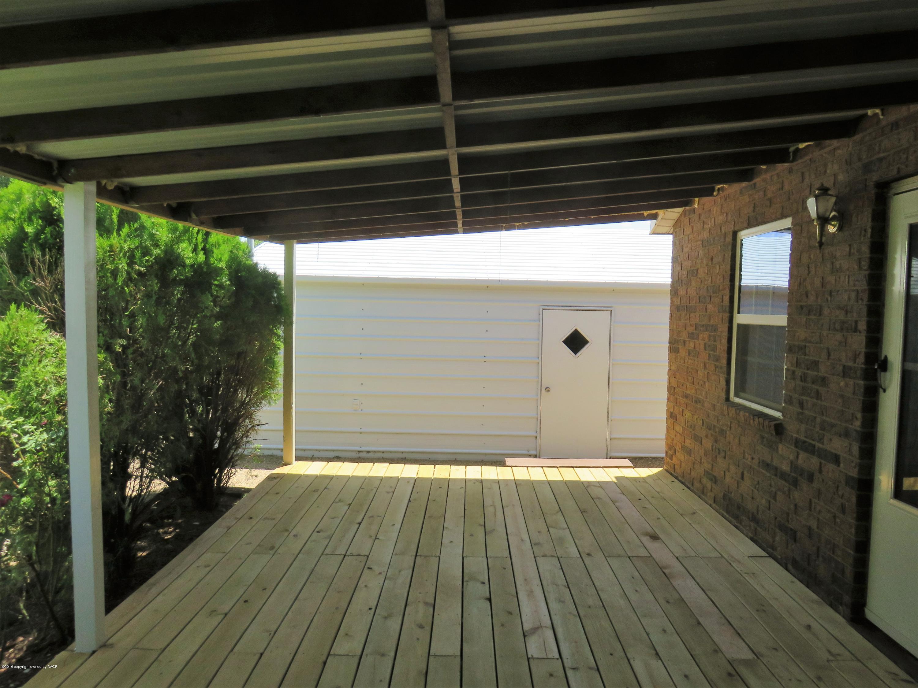 9613 River Road Amarillo, TX 79108 - Photo 26 of 29 From Front Porch, Door into Garage