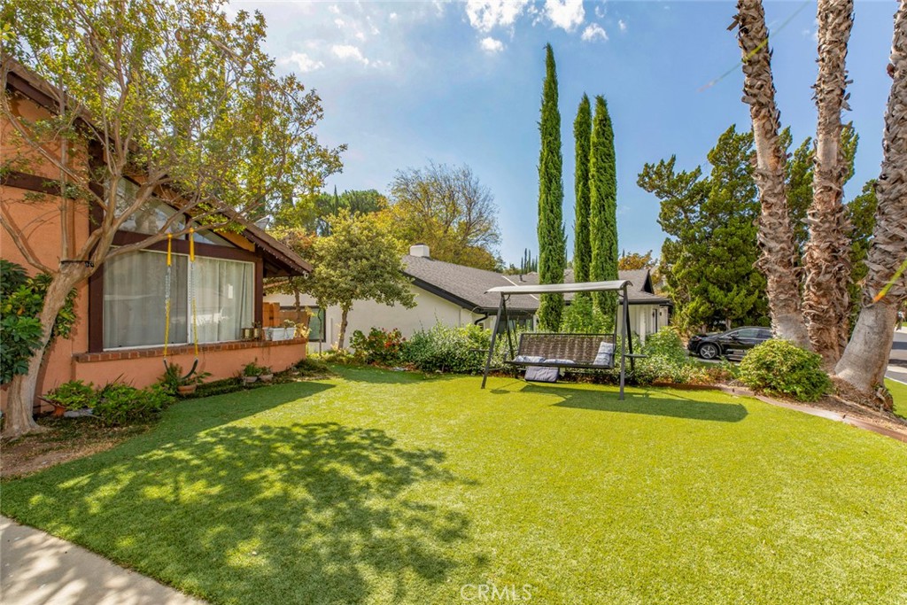 18810 Kirkcolm Lane Porter Ranch, CA 91326 - Photo 10 of 75 a view of a house with a yard and tree s