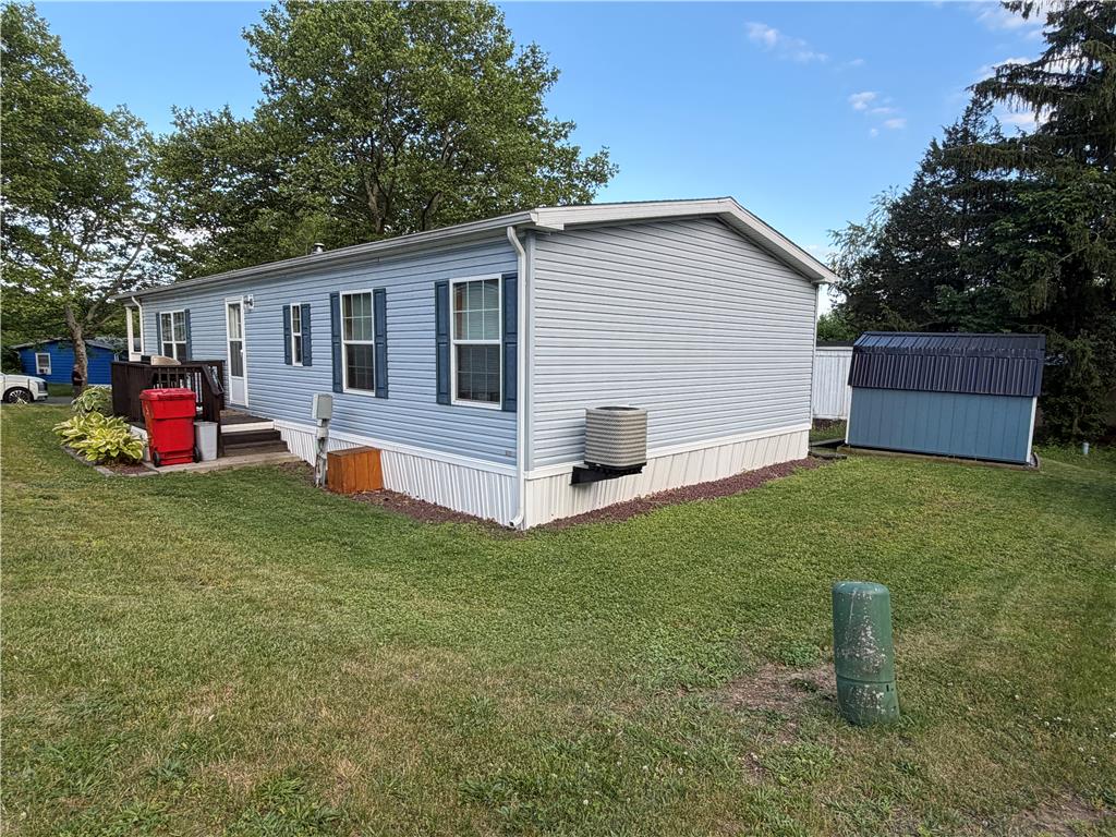 12 Springridge Road Bath, PA 18014 - Photo 35 of 61 A well-maintained single-story residence with a charming exterior and a convenient storage shed.