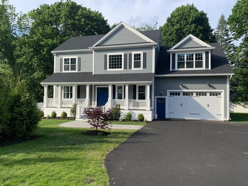 196 Reedsdale Road Milton, MA 02186 - Photo 1 of 20 a front view of a house with a garden and trees