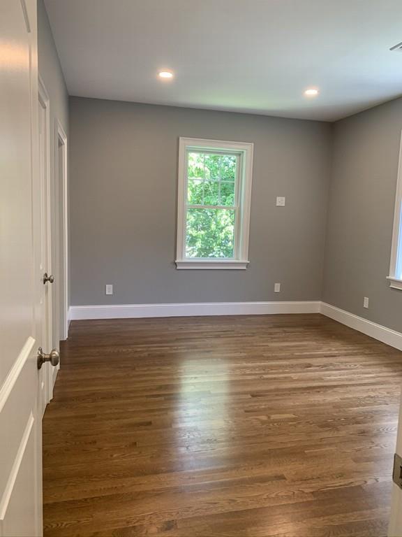 196 Reedsdale Road Milton, MA 02186 - Photo 17 of 20 an empty room with wooden floor and windows