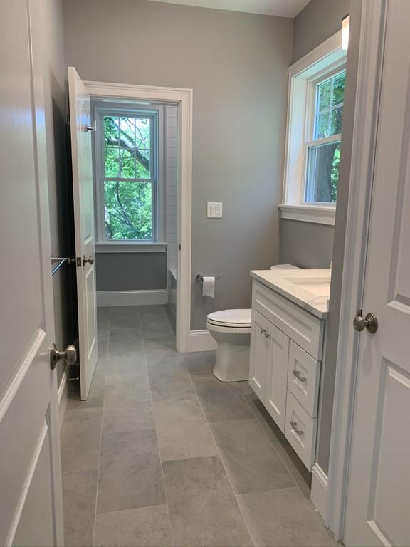 196 Reedsdale Road Milton, MA 02186 - Photo 18 of 20 a bathroom with a toilet sink and a window