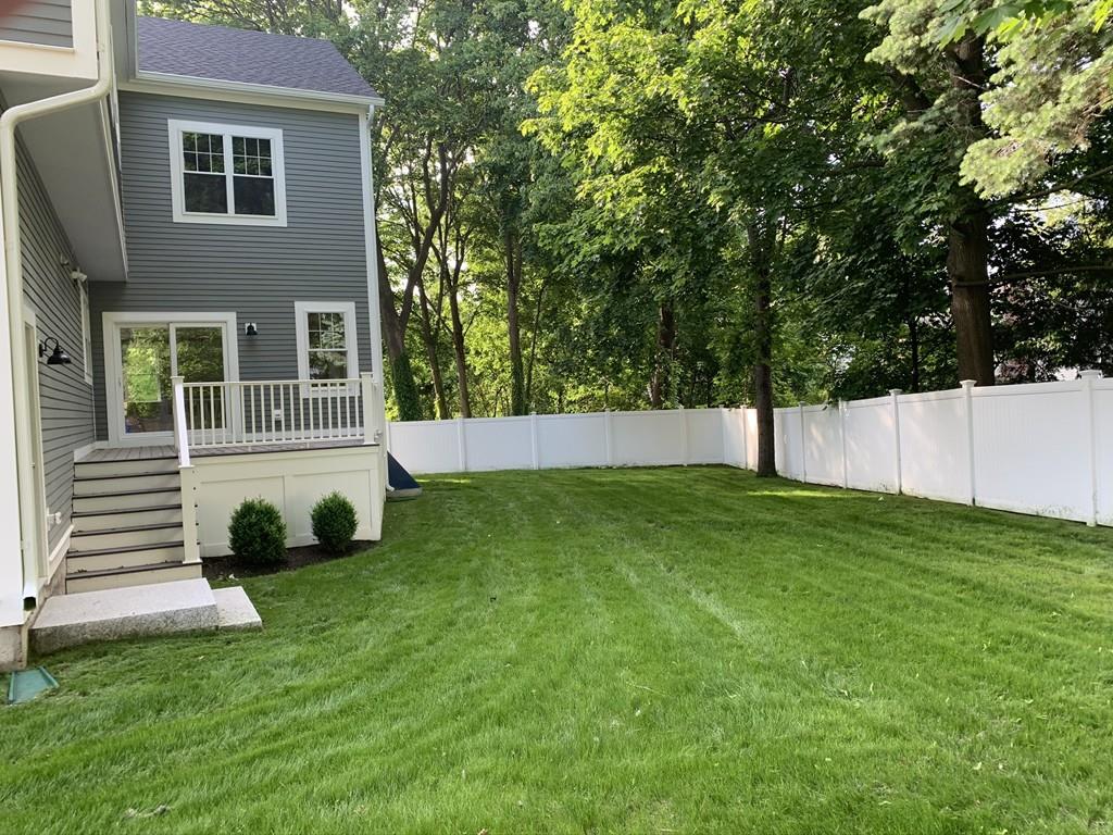 196 Reedsdale Road Milton, MA 02186 - Photo 3 of 20 a view of a backyard with a garden
