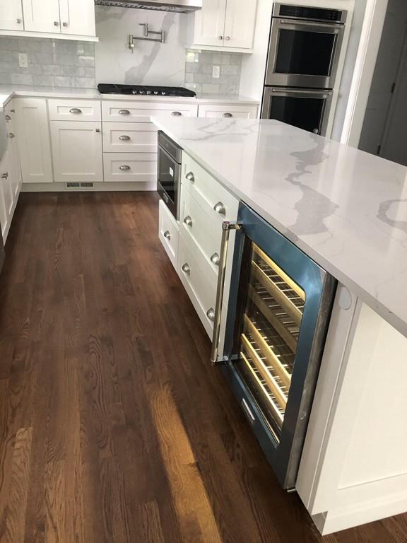 196 Reedsdale Road Milton, MA 02186 - Photo 5 of 20 a kitchen with stainless steel appliances a stove a sink and a microwave
