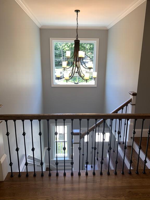 196 Reedsdale Road Milton, MA 02186 - Photo 10 of 20 a view of entryway with a floor to ceiling window and wooden floor