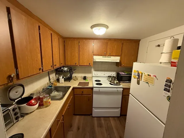 a kitchen that has a sink and a stove