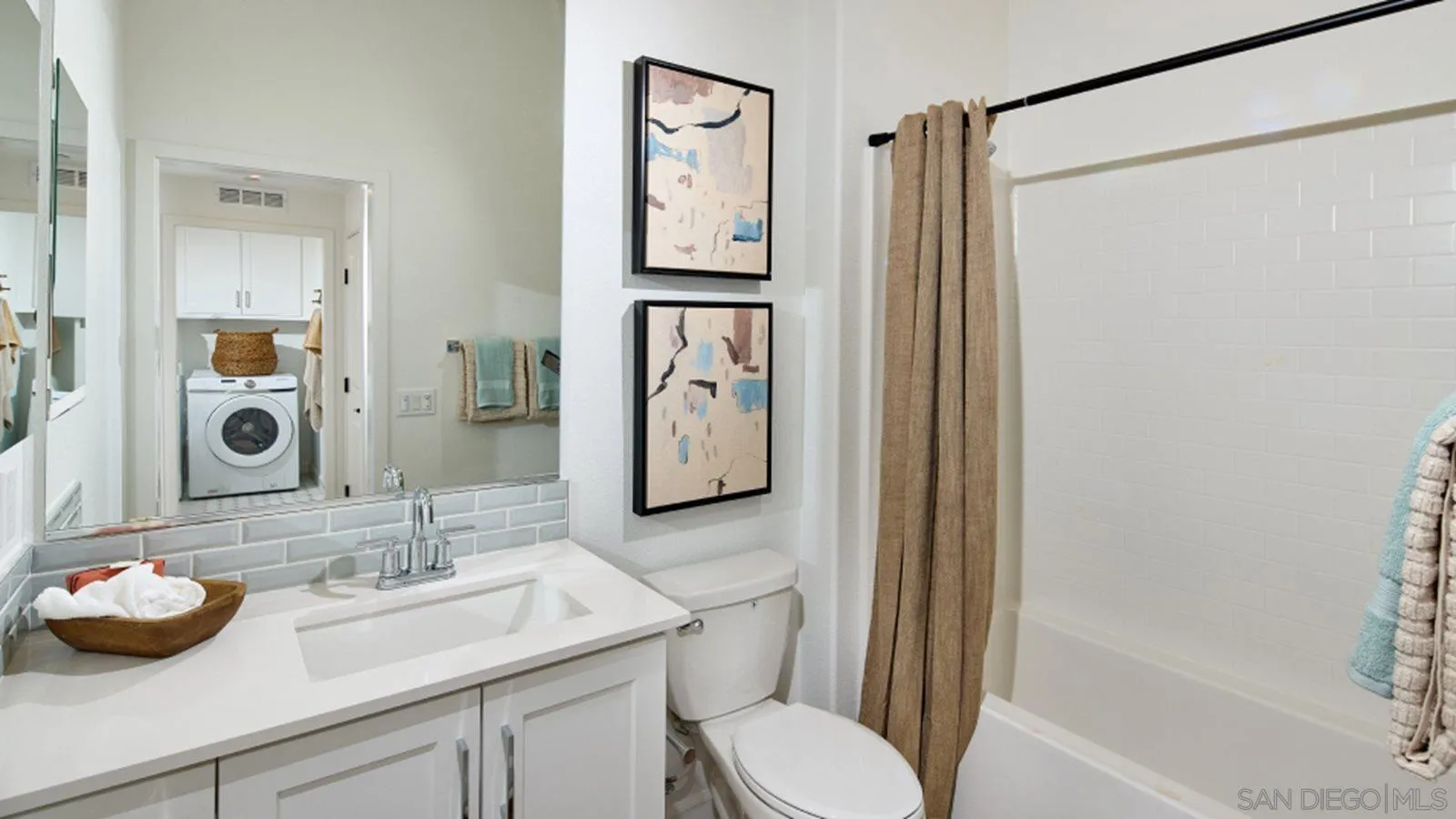 15366 Junipers Drive San Diego, CA 92129 - Photo 11 of 19 a bathroom with a granite countertop sink toilet and shower