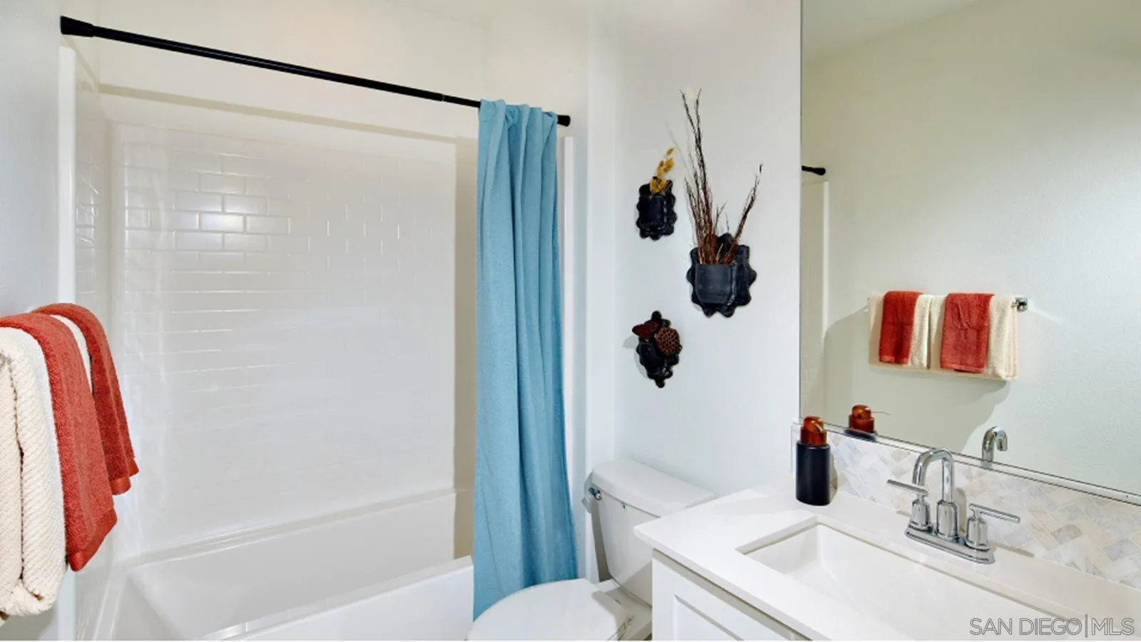 15366 Junipers Drive San Diego, CA 92129 - Photo 13 of 19 a bathroom with a sink toilet and shower