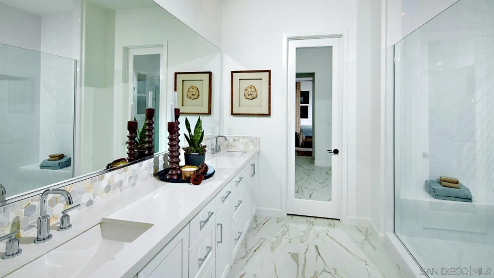 15366 Junipers Drive San Diego, CA 92129 - Photo 15 of 19 a bathroom with a tub sink and mirror