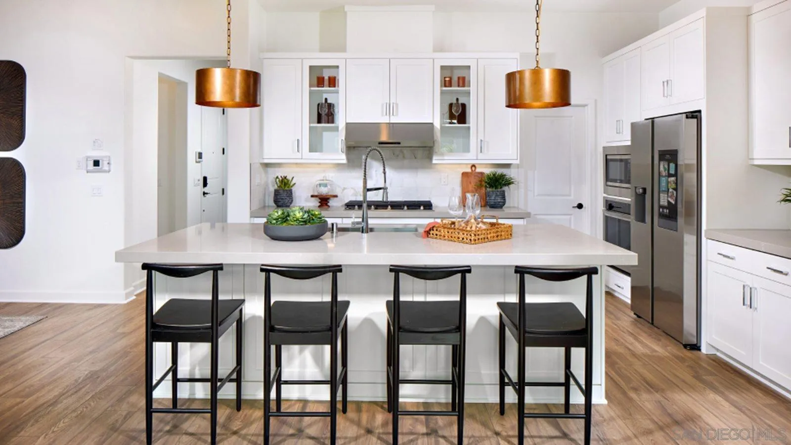 15366 Junipers Drive San Diego, CA 92129 - Photo 3 of 19 a view of kitchen with dining table and chairs
