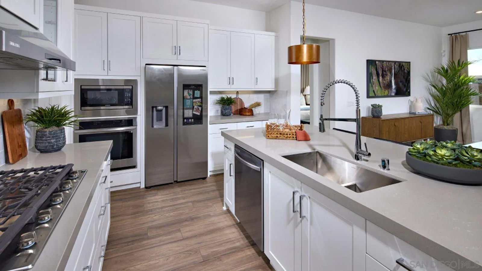15366 Junipers Drive San Diego, CA 92129 - Photo 5 of 19 a kitchen with a sink stove and refrigerator
