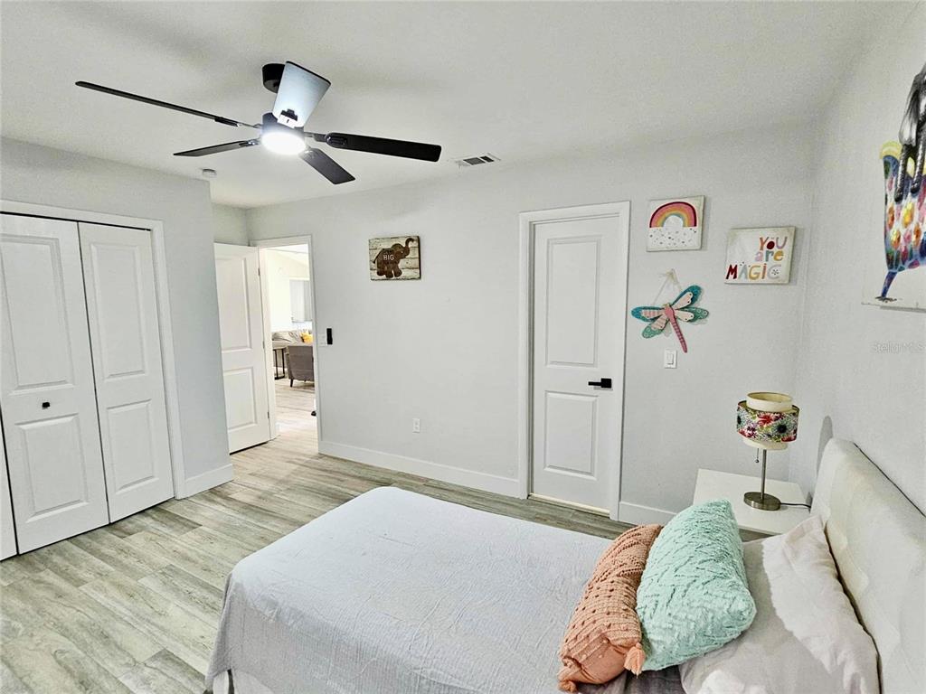 5407 Southwest 82 Terrace Gainesville, FL 32608 - Photo 24 of 31 a bedroom with a bed and a window