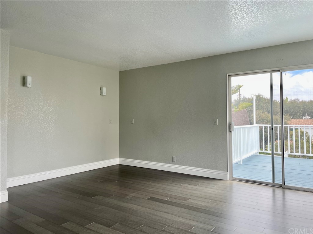 33881 Orilla Road Dana Point, CA 92629 - Photo 16 of 20 wooden floor in an empty room with a window