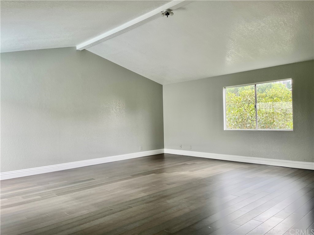 33881 Orilla Road Dana Point, CA 92629 - Photo 19 of 20 an empty room with wooden floor and windows