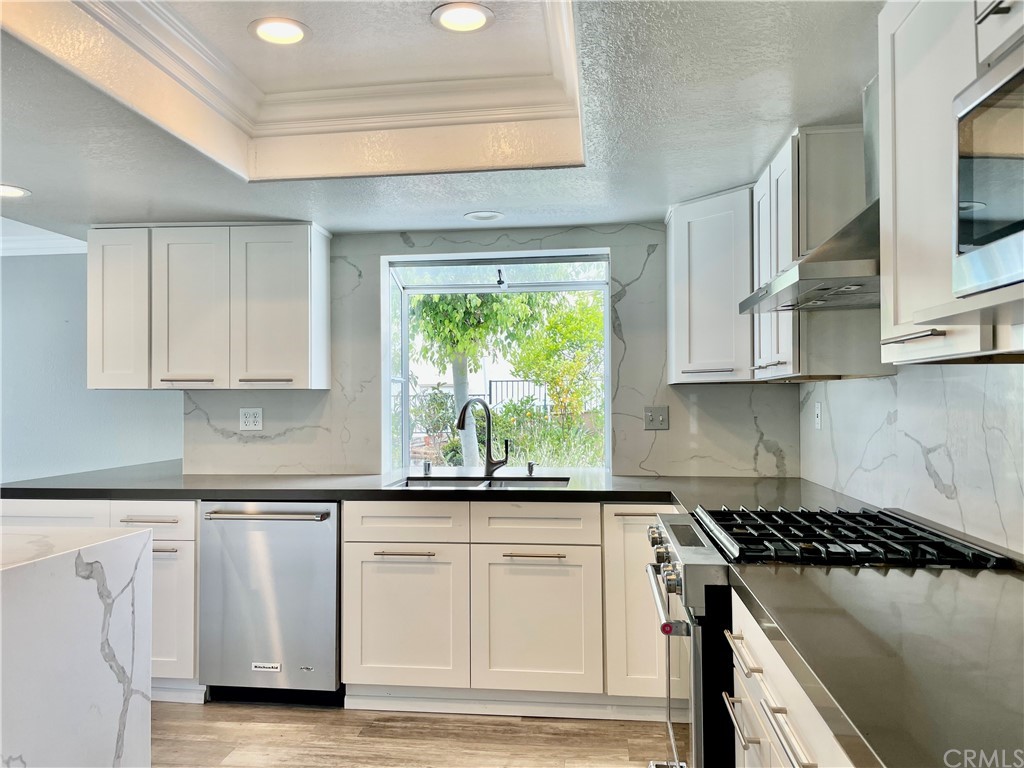 33881 Orilla Road Dana Point, CA 92629 - Photo 5 of 20 a kitchen with white cabinets appliances and a window
