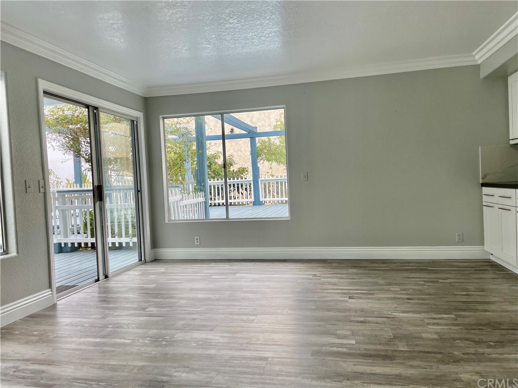 33881 Orilla Road Dana Point, CA 92629 - Photo 8 of 20 a view of an empty room with wooden floor and a window