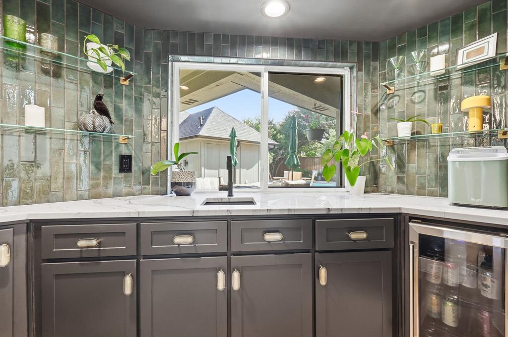 5516 Bent Trail Dallas, TX 75248 - Photo 12 of 32 a kitchen with a sink and a mirror