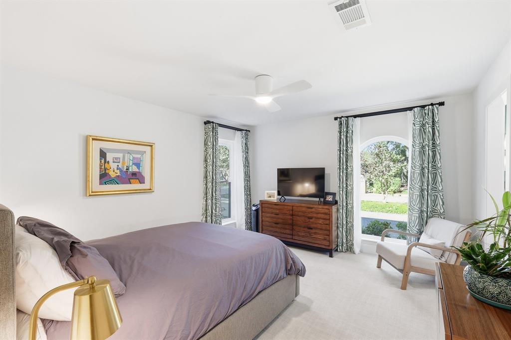 5516 Bent Trail Dallas, TX 75248 - Photo 17 of 32 a bedroom with a bed and wooden floor