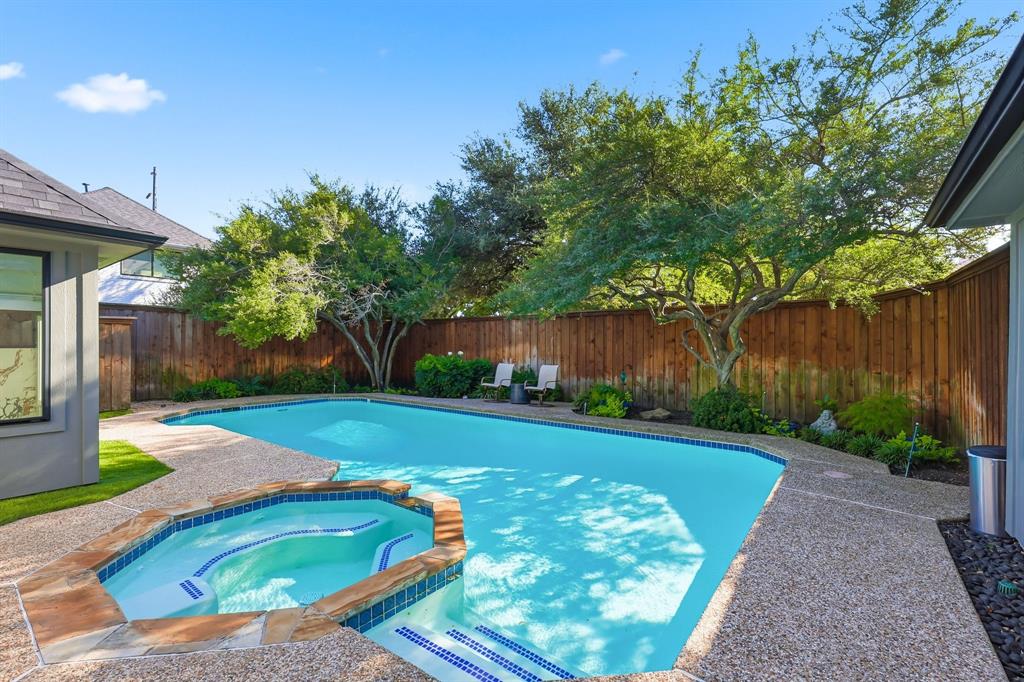 5516 Bent Trail Dallas, TX 75248 - Photo 24 of 32 a view of a backyard with table and chairs plants and wooden fence