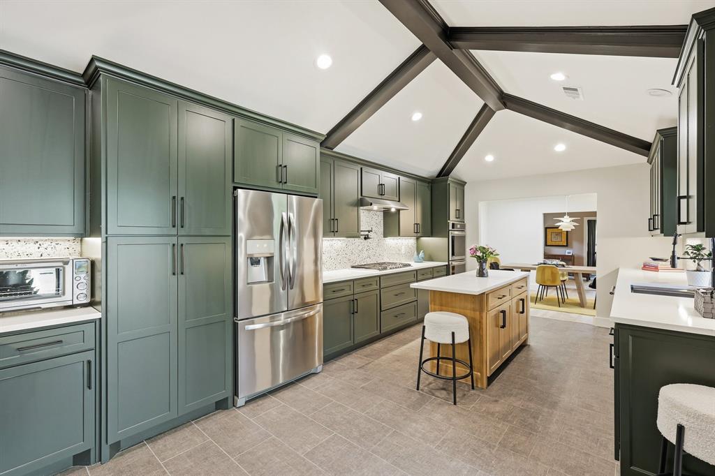 5516 Bent Trail Dallas, TX 75248 - Photo 7 of 32 a kitchen with refrigerator and furniture