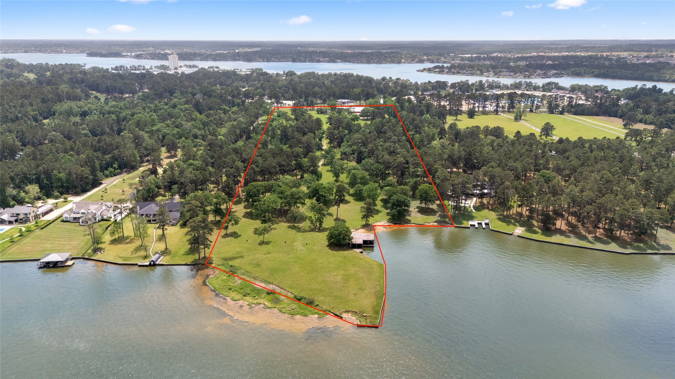15126 Walden Road Montgomery, TX 77356 - Photo 4 of 50 A view of the waterfront frontage with an island jutting out giving unobstructed views of the lake. (Red outline approximate)