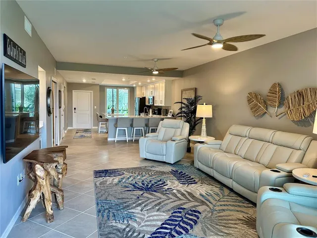 a bedroom with a bed and a lamp on dresser