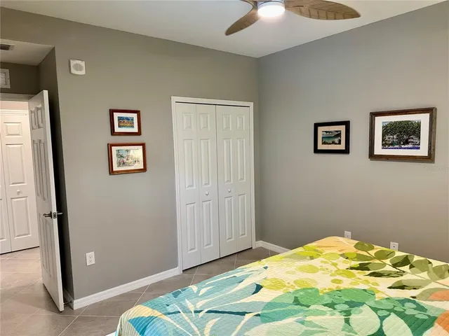 an aerial view of a house with outdoor space and a lake view
