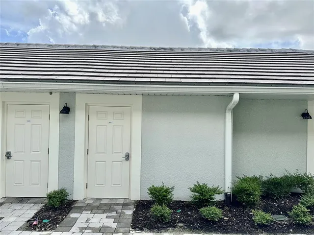 a view of a golf course with a house