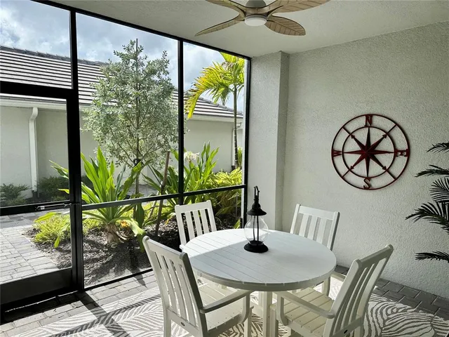 a view of swimming pool with outdoor seating and garden