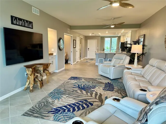 a living room with furniture and a rug