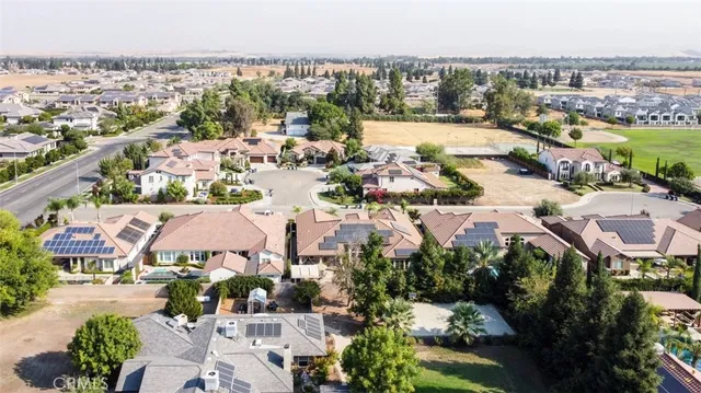an aerial view of a house with a swimming pool