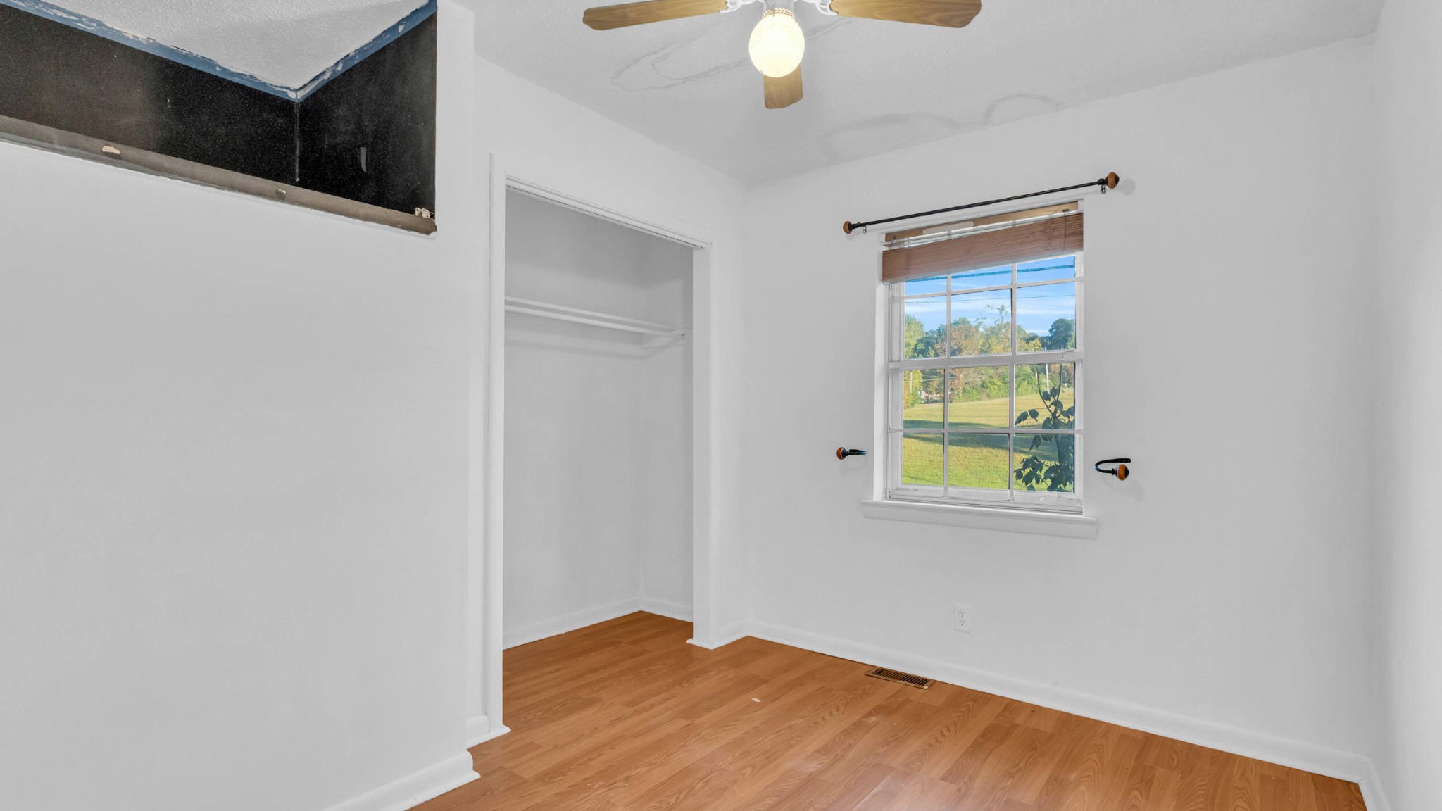 8 East Sharon Circle Ringgold, GA 30736 - Photo 12 of 32 a view of an empty room with window and wooden floor