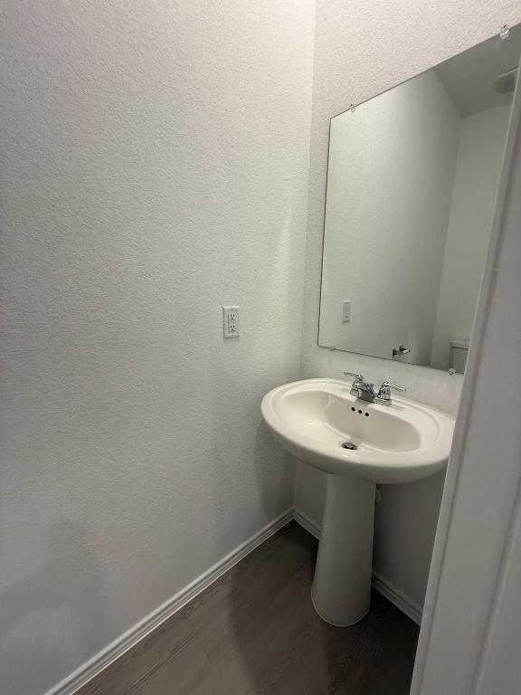 962 Soapstone Pass Maxwell, TX 78656 - Photo 11 of 23 a bathroom with a sink and a mirror