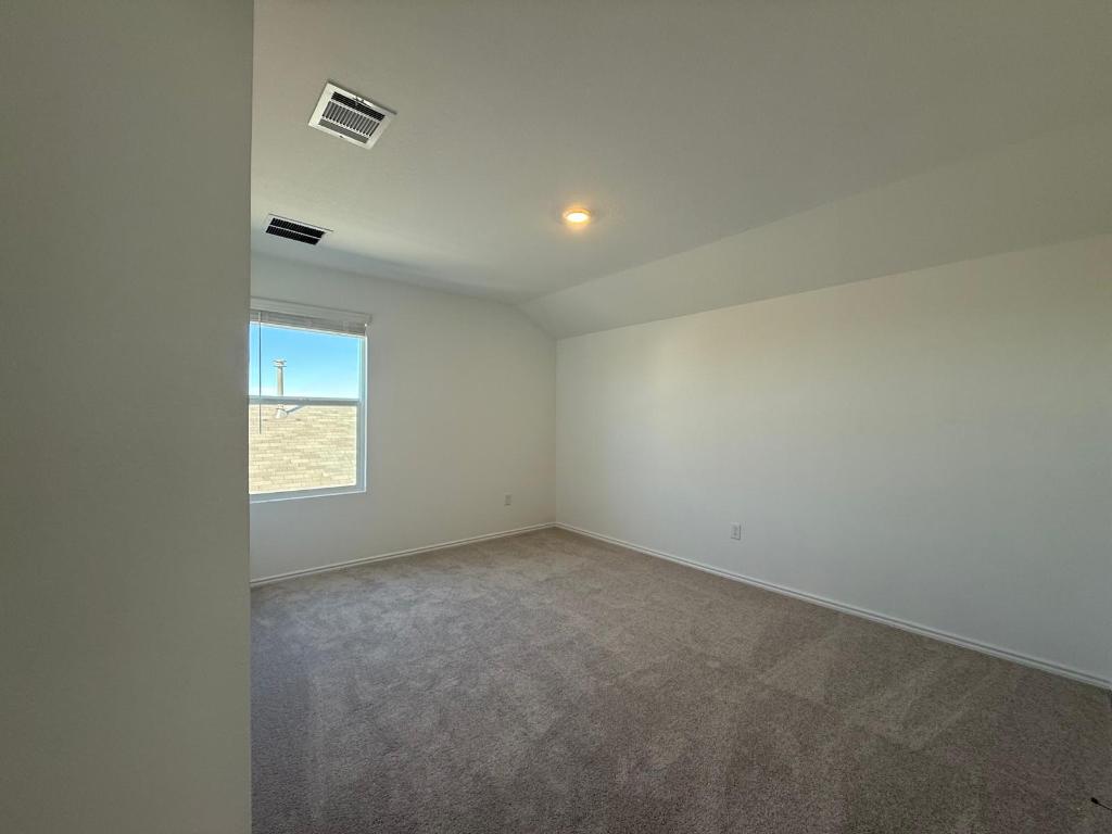 962 Soapstone Pass Maxwell, TX 78656 - Photo 19 of 23 an empty room with a empty space and windows