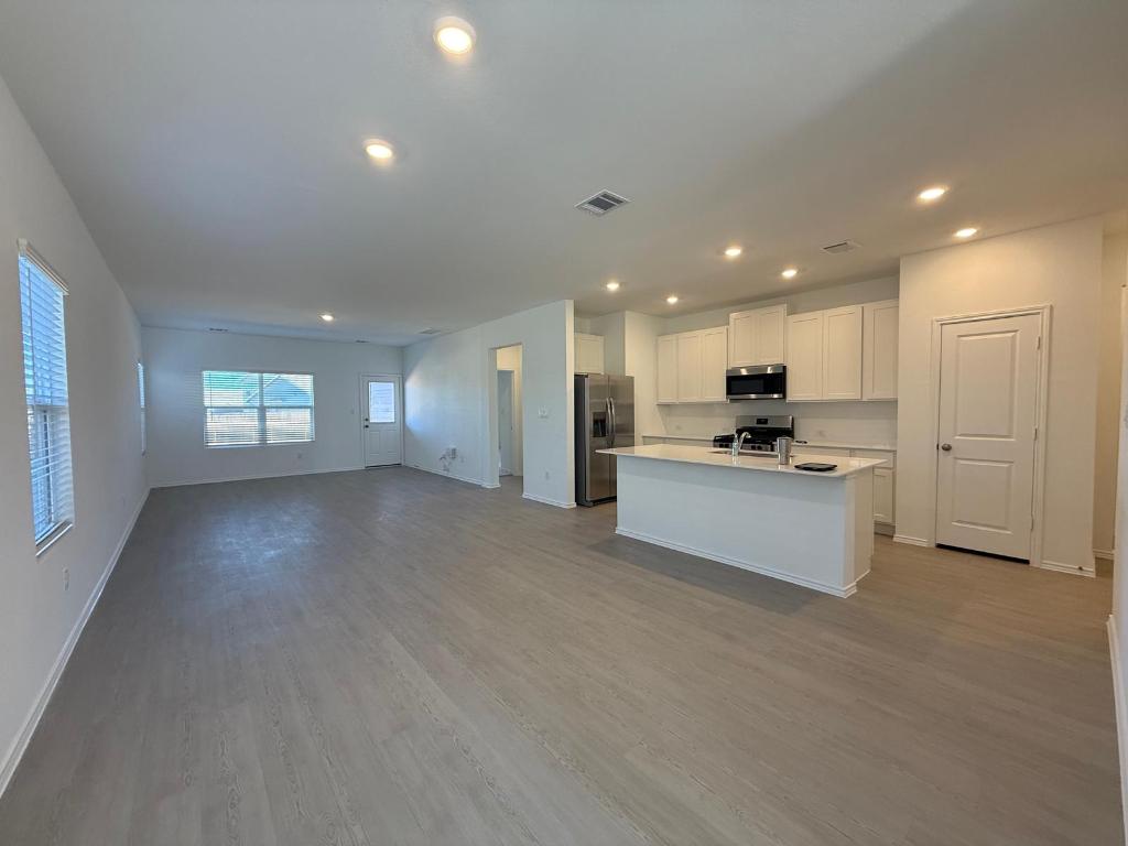 962 Soapstone Pass Maxwell, TX 78656 - Photo 2 of 23 a view of kitchen with kitchen island and stainless steel appliances
