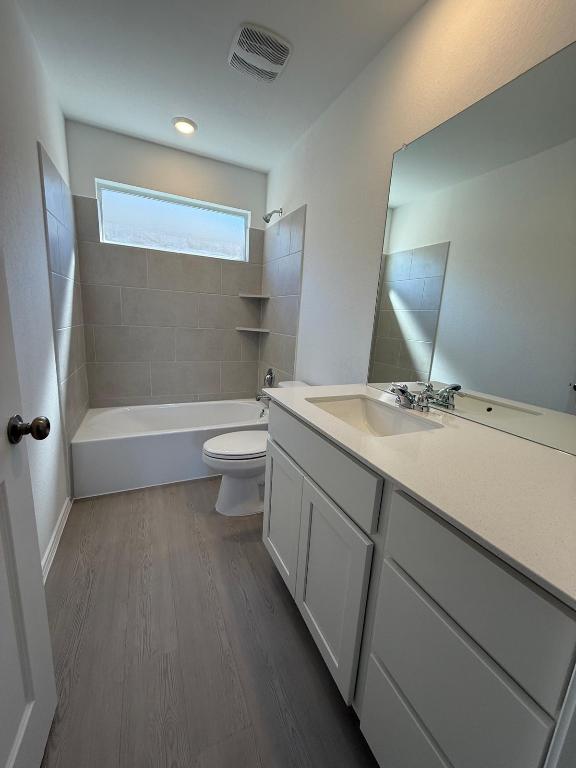 962 Soapstone Pass Maxwell, TX 78656 - Photo 21 of 23 a bathroom with a sink a toilet and shower