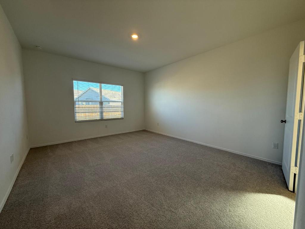 962 Soapstone Pass Maxwell, TX 78656 - Photo 6 of 23 an empty room with windows