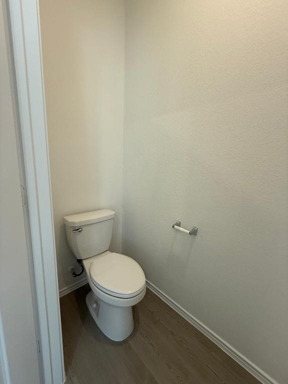 962 Soapstone Pass Maxwell, TX 78656 - Photo 8 of 23 a white toilet sitting next to a shower