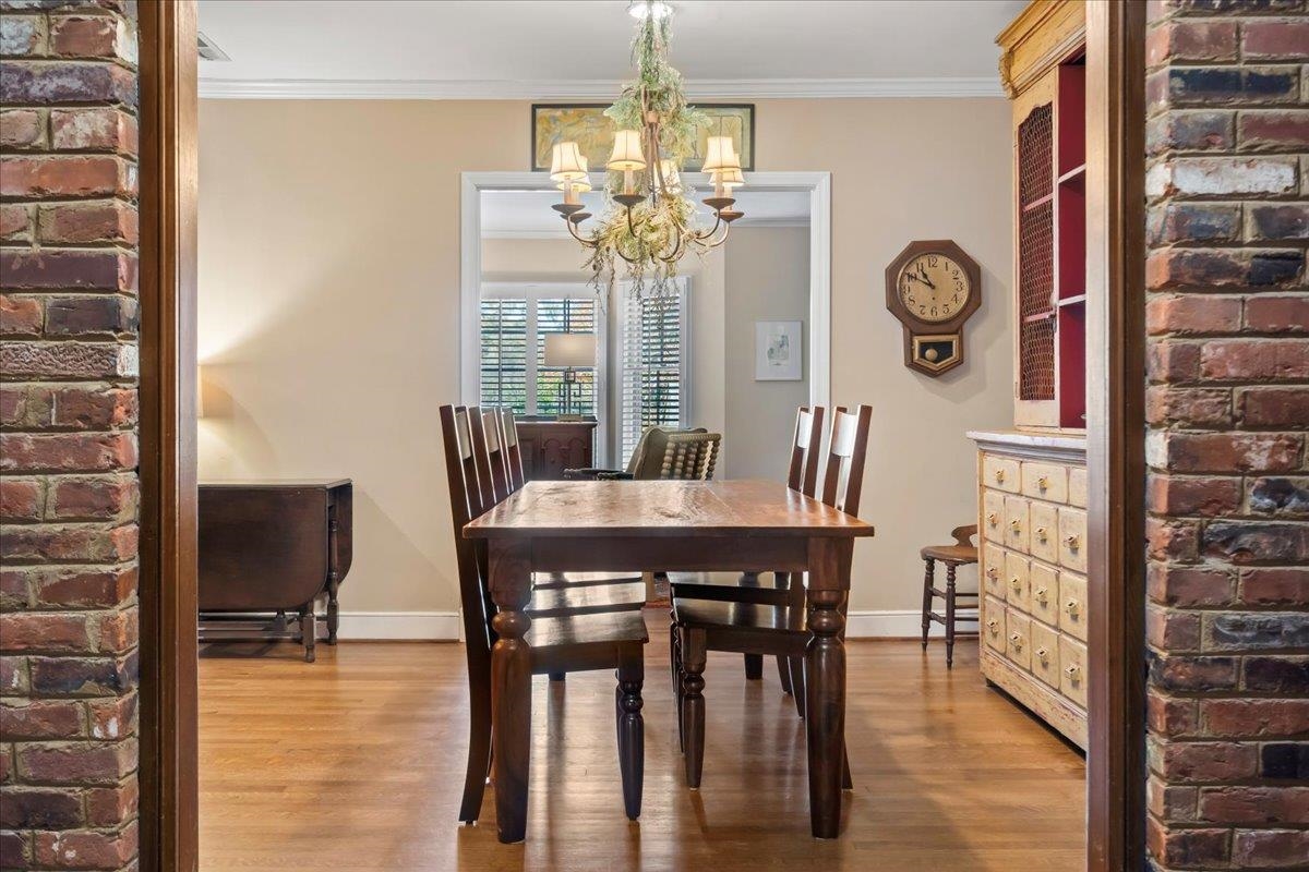 4277 Sequoia Road Memphis, TN 38117 - Photo 11 of 36 a view of a dining room with furniture and chandelier