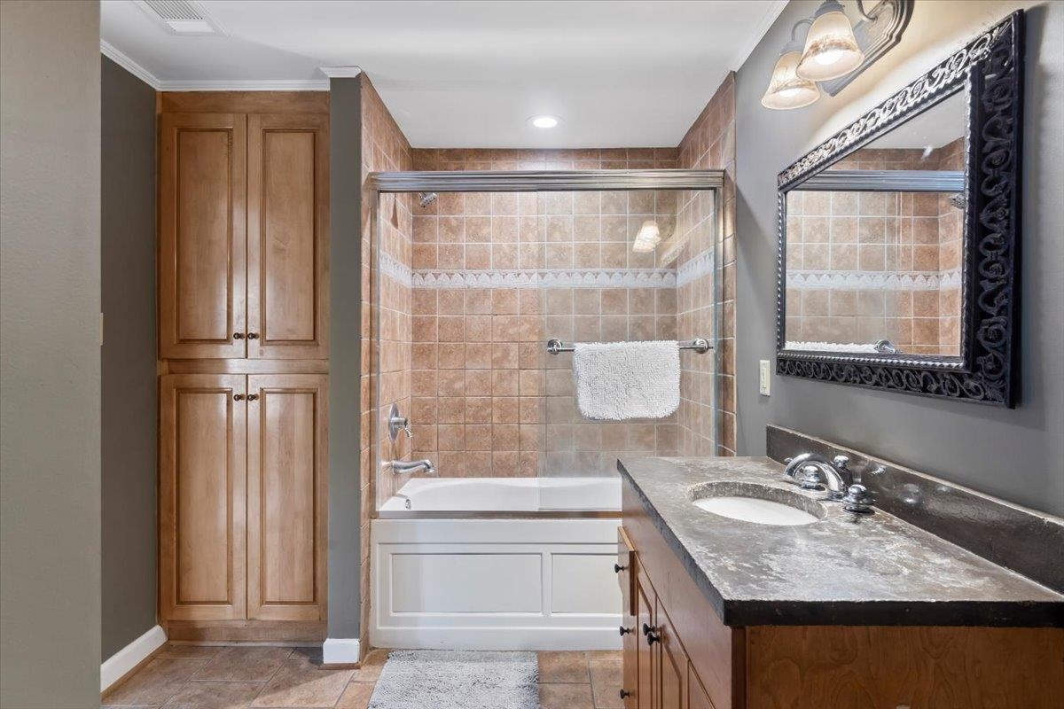 4277 Sequoia Road Memphis, TN 38117 - Photo 19 of 36 a bathroom with a granite countertop sink and a mirror