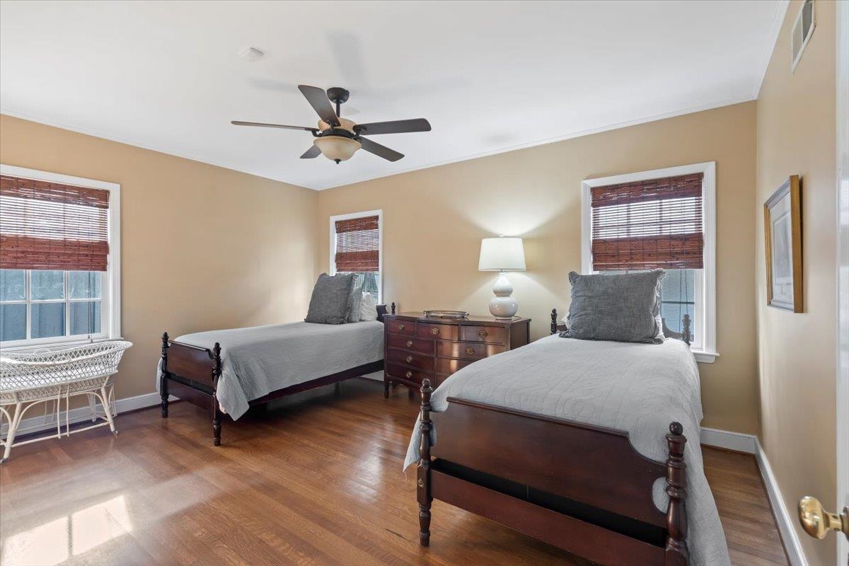 4277 Sequoia Road Memphis, TN 38117 - Photo 20 of 36 a bedroom with a bed and wooden floor