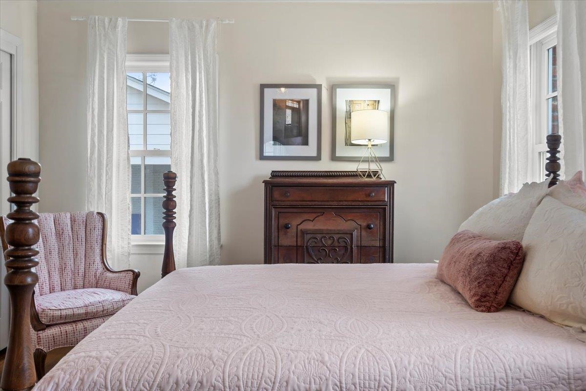 4277 Sequoia Road Memphis, TN 38117 - Photo 23 of 36 a bedroom with a bed and wooden floor
