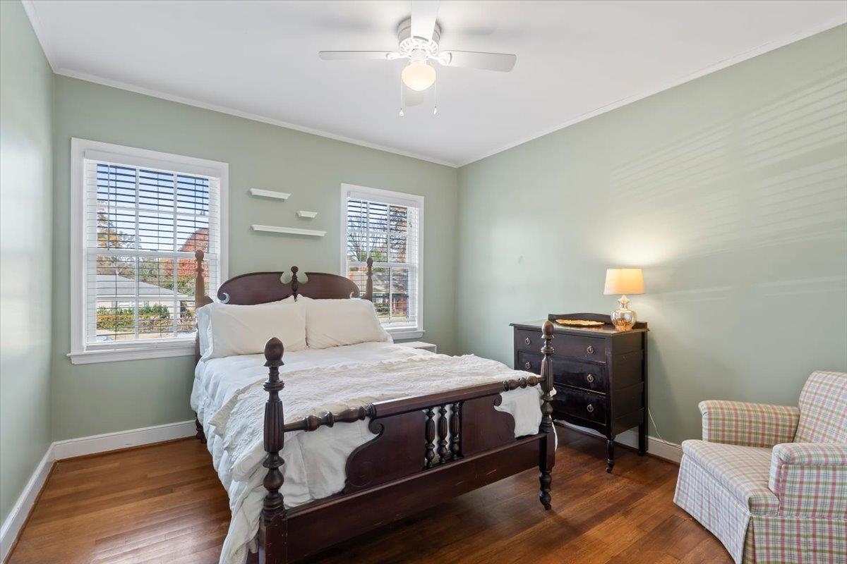 4277 Sequoia Road Memphis, TN 38117 - Photo 24 of 36 a bedroom with a bed and wooden floor