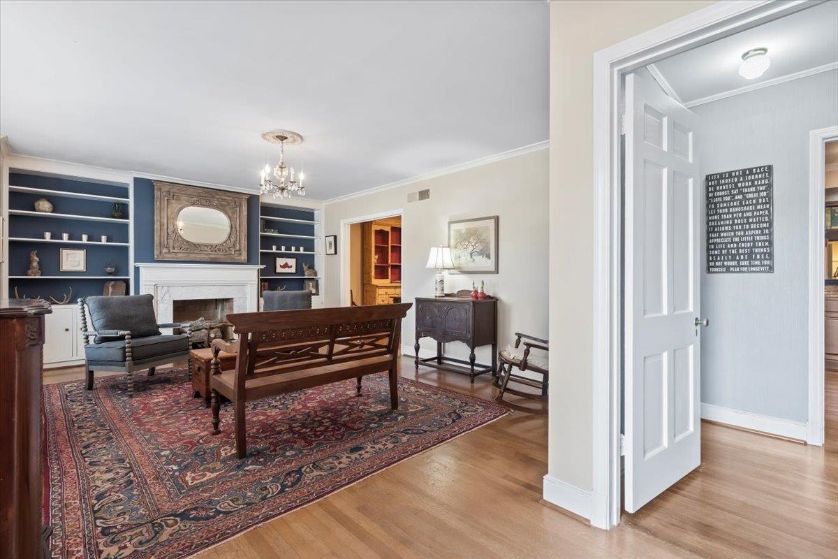 4277 Sequoia Road Memphis, TN 38117 - Photo 5 of 36 a living room with furniture a rug and a piano