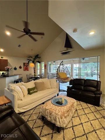 a living room with furniture and a rug
